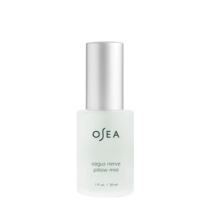 Opaque glass bottle of osea vagus nerve pillow mist with a silver cap, isolated on a white background.